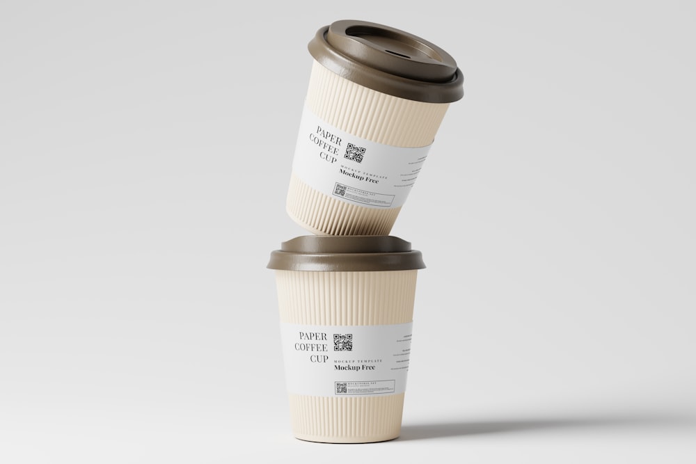 two coffee cups stacked on top of each other