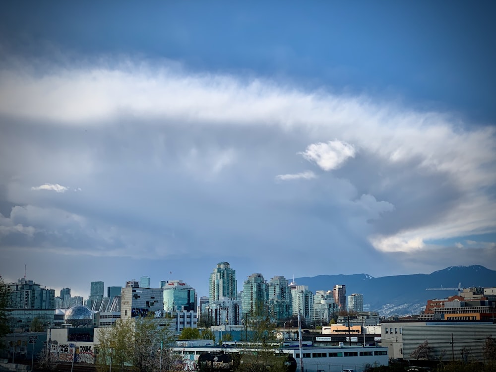 a view of a city with mountains in the background