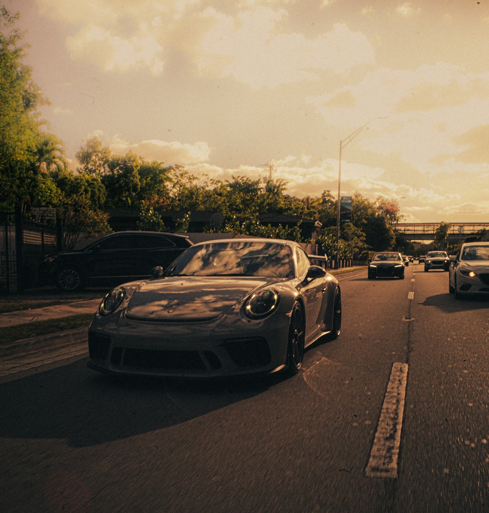 a group of cars that are sitting in the street