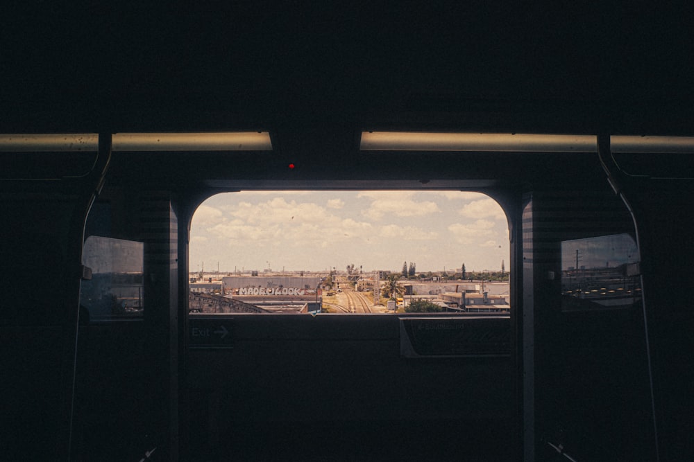 a view of a city from inside a bus