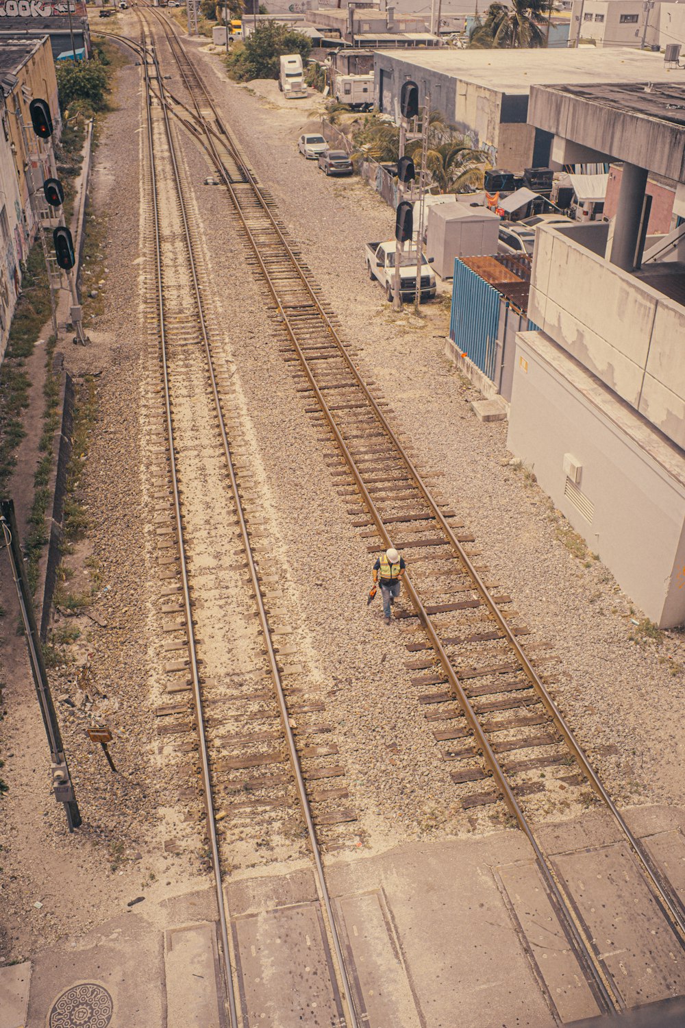 a man is standing on a train track
