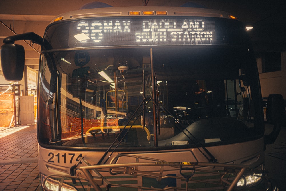a bus parked in a bus station at night