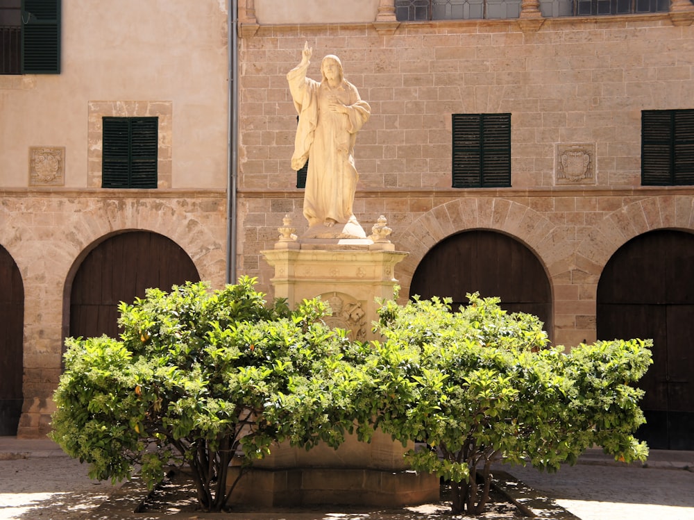 a statue of a woman in a courtyard