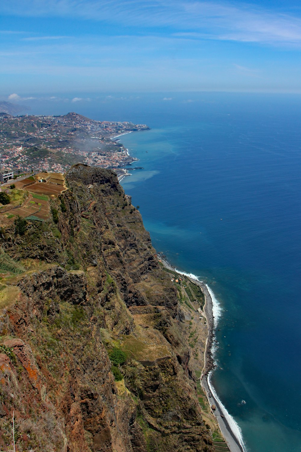 a scenic view of the ocean from a hill