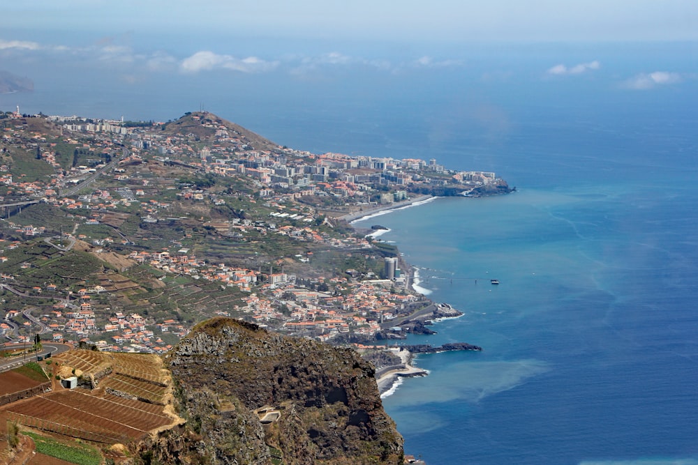 an aerial view of a city and a body of water