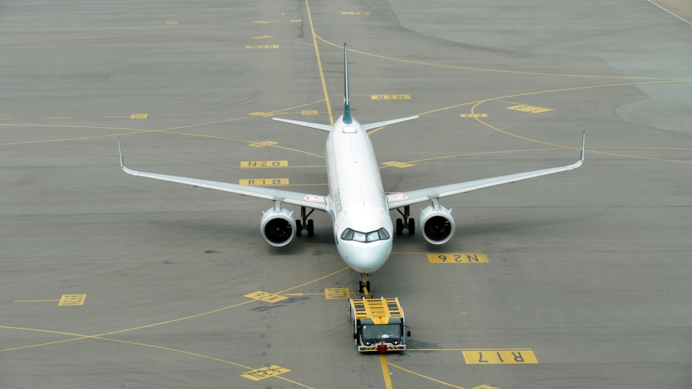 a large jetliner sitting on top of an airport tarmac