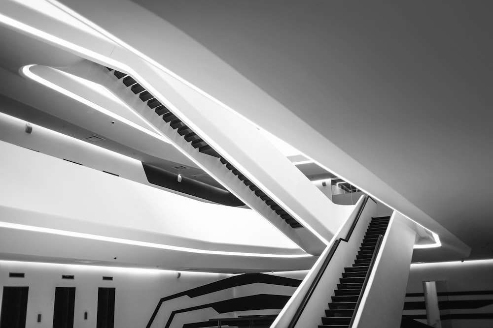 a black and white photo of an escalator