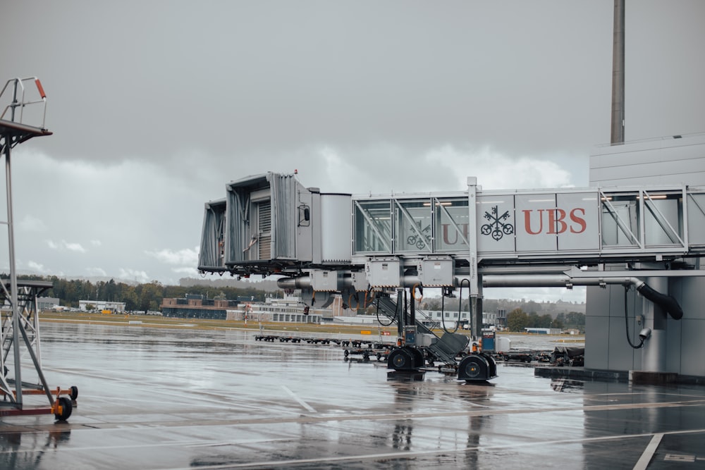 an airport terminal with a sign that says ubs on it