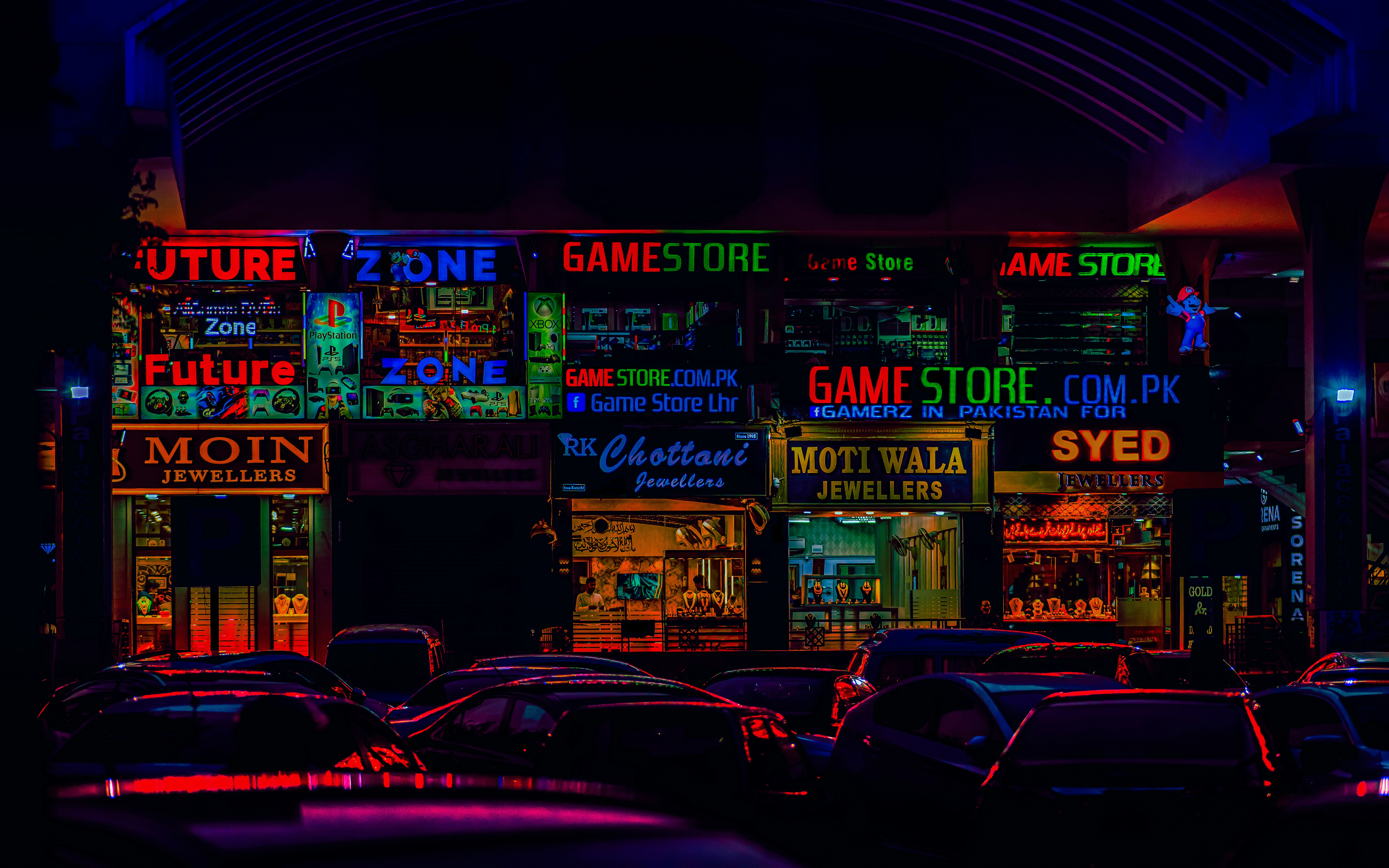 a bunch of cars parked in front of a store