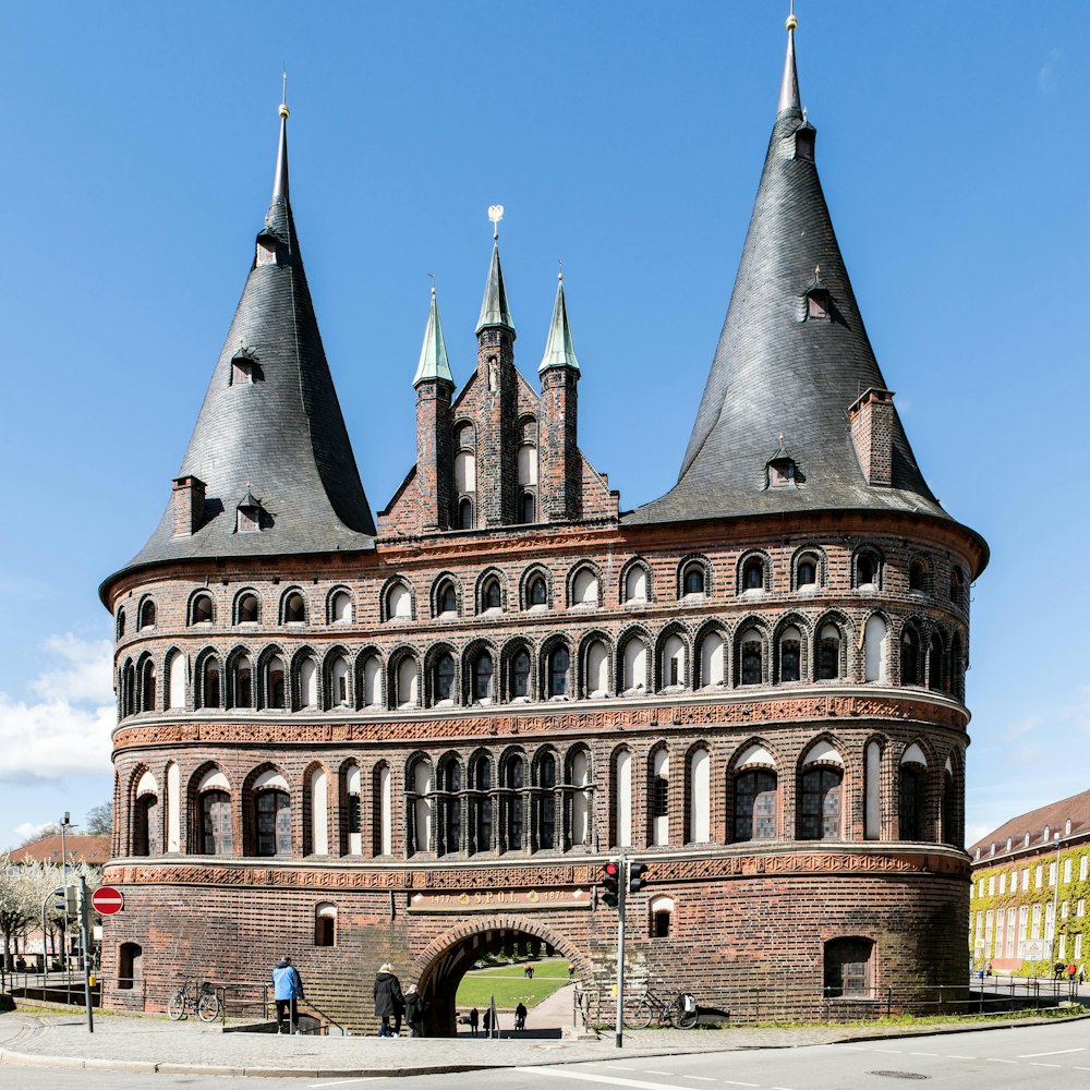 a large brick building with two towers on top of it