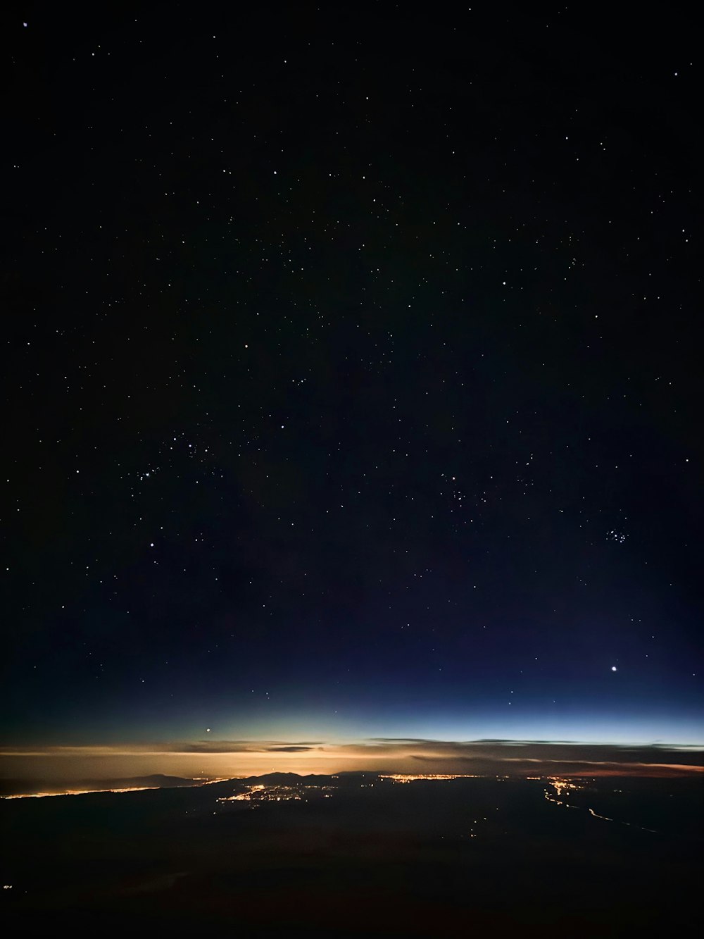 a view of the night sky from an airplane