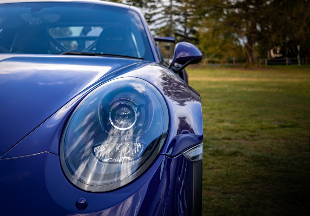 a close up of a blue sports car