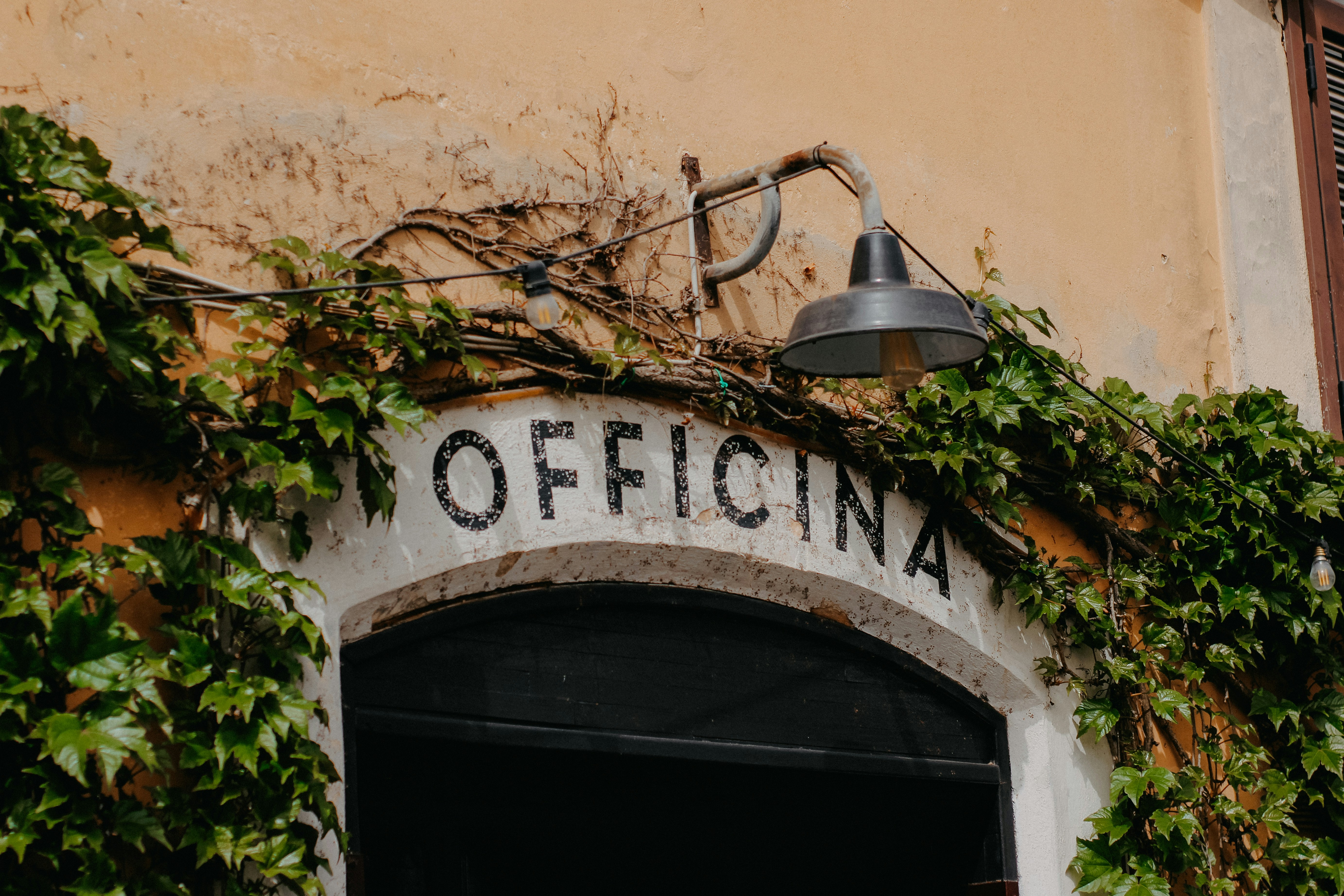 a lamp hanging from the side of a building