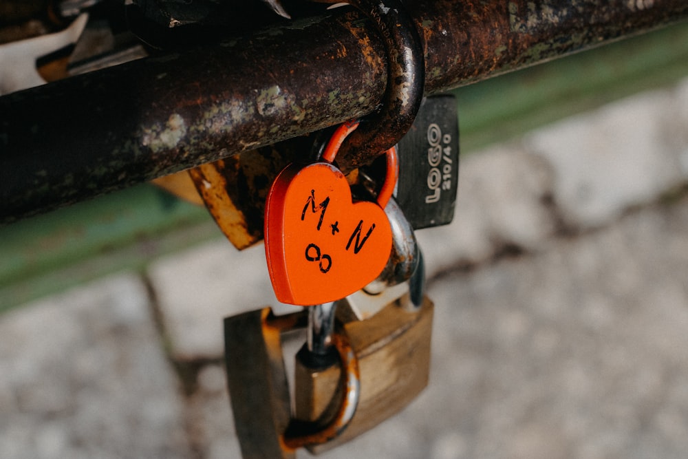 a padlock with a heart shaped lock attached to it
