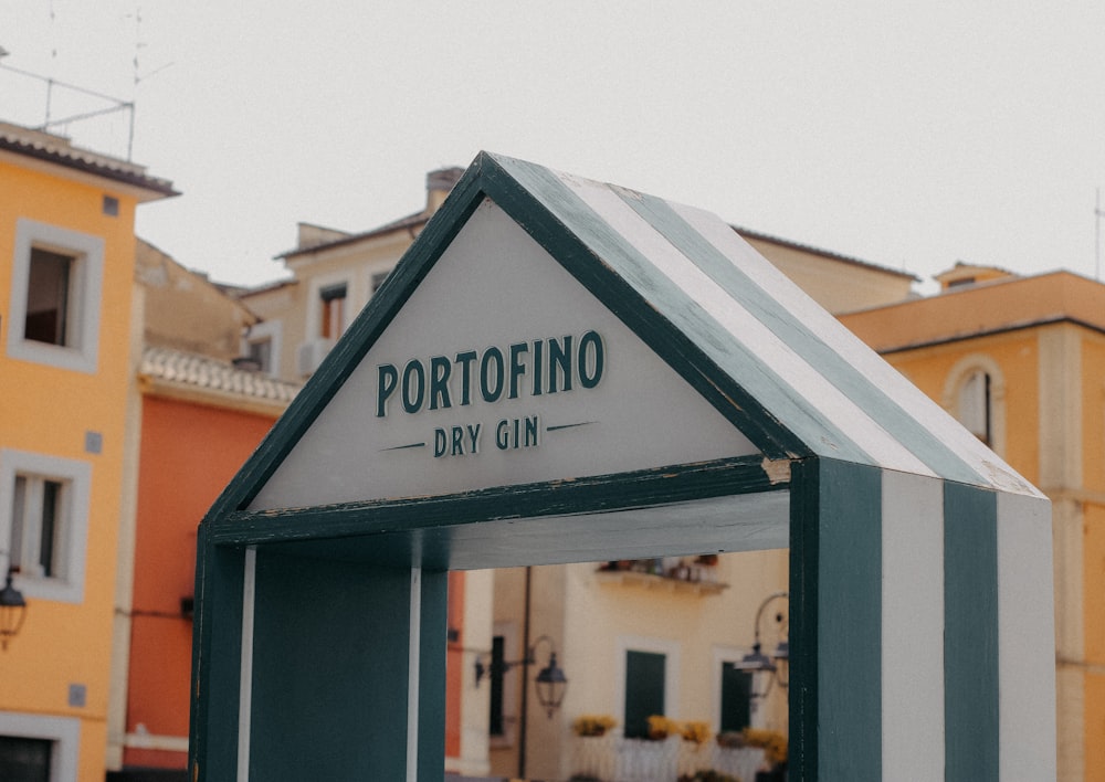 a small building with a sign that says portofino diy cin