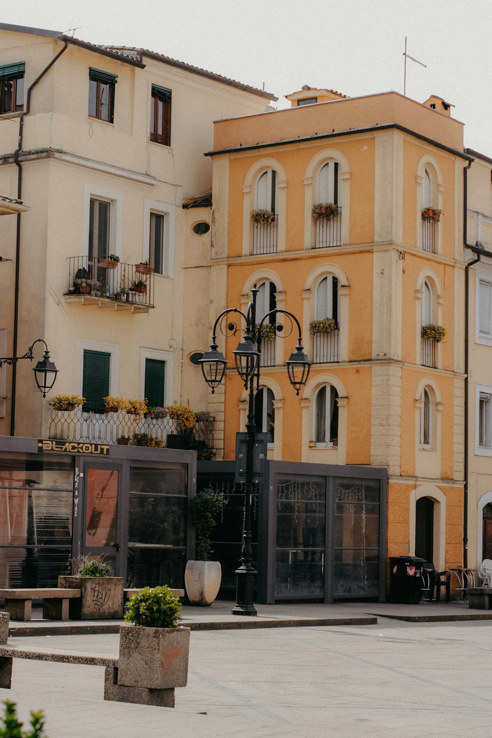 a yellow building with a clock tower in front of it