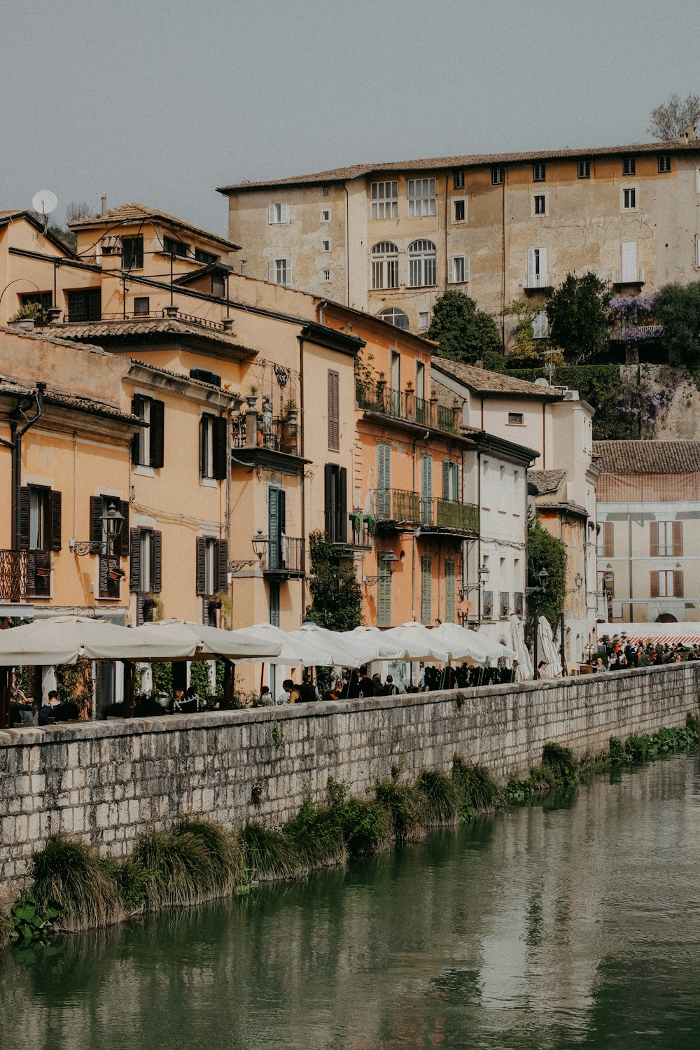 a row of buildings next to a body of water