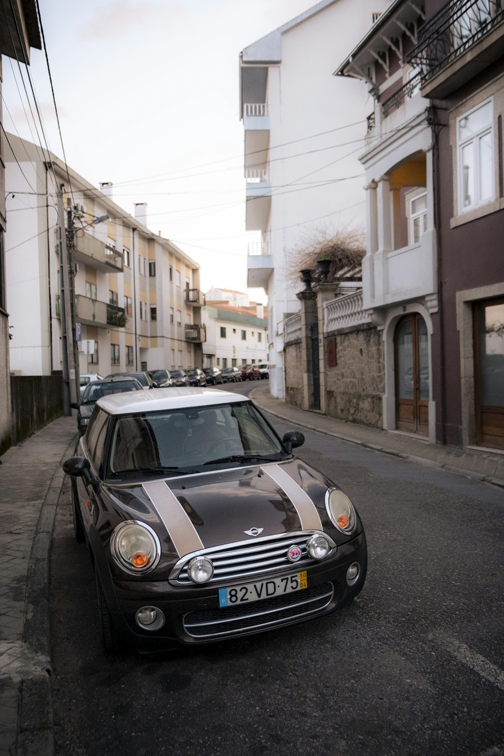 a small car parked on the side of a street