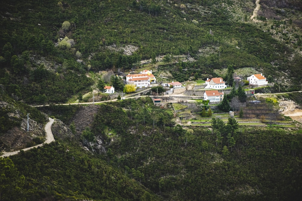 an aerial view of a village in the mountains