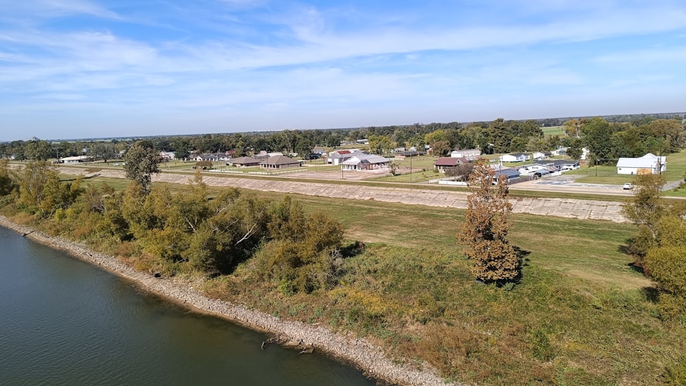 an aerial view of a small town near a river