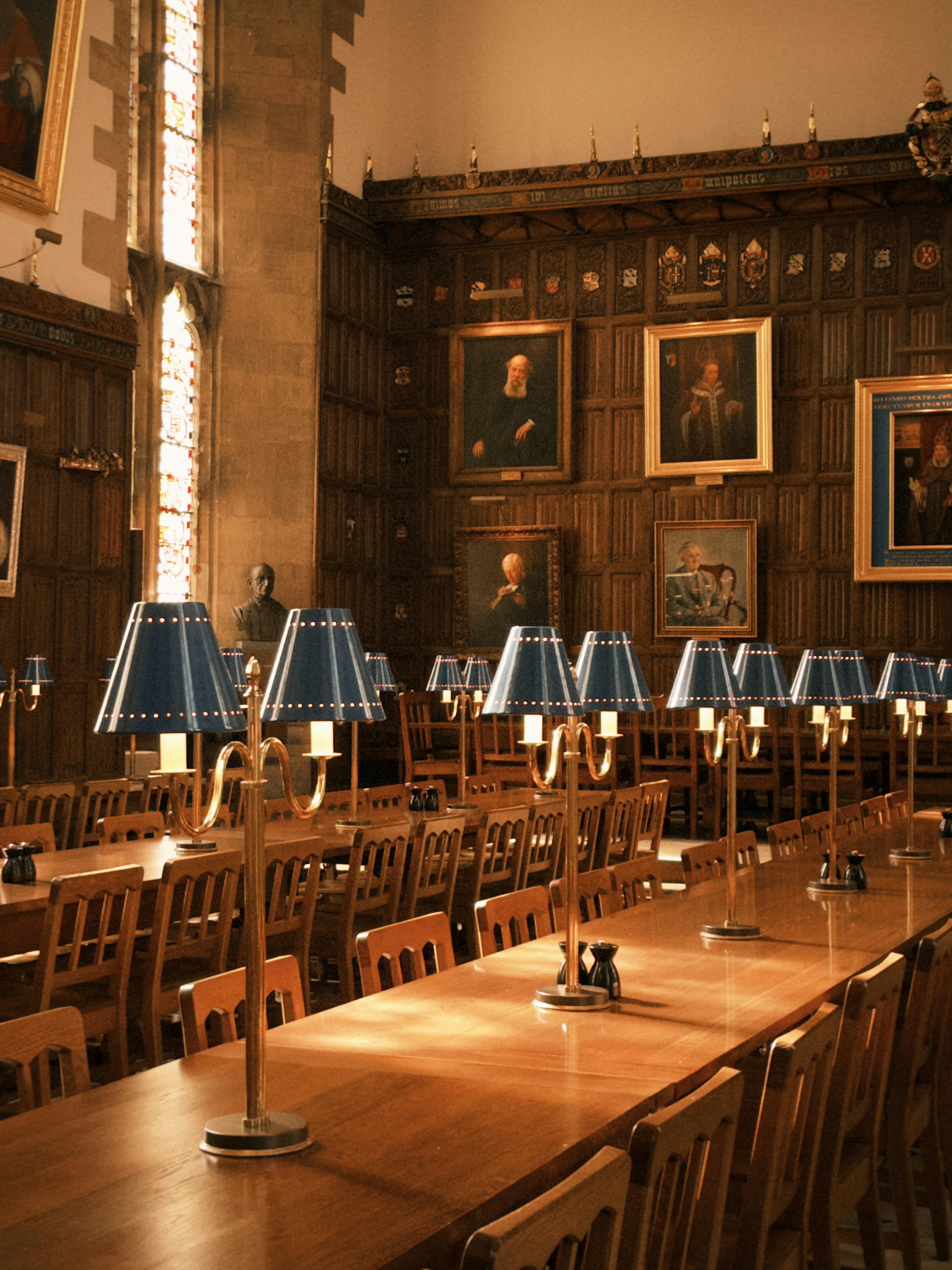 Lamps on the long tables of the dining hall