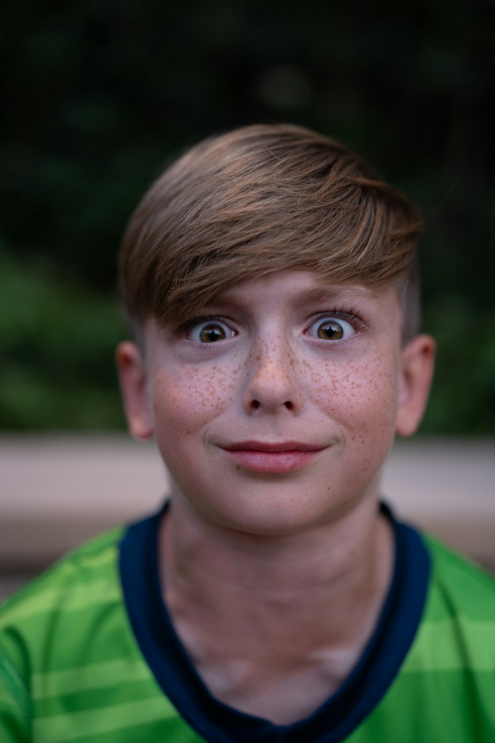 a young boy with freckles on his face