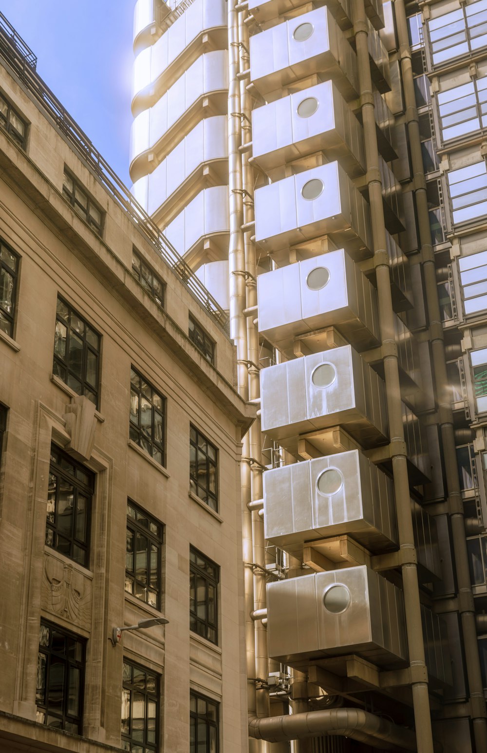 a tall building with lots of windows next to a tall building