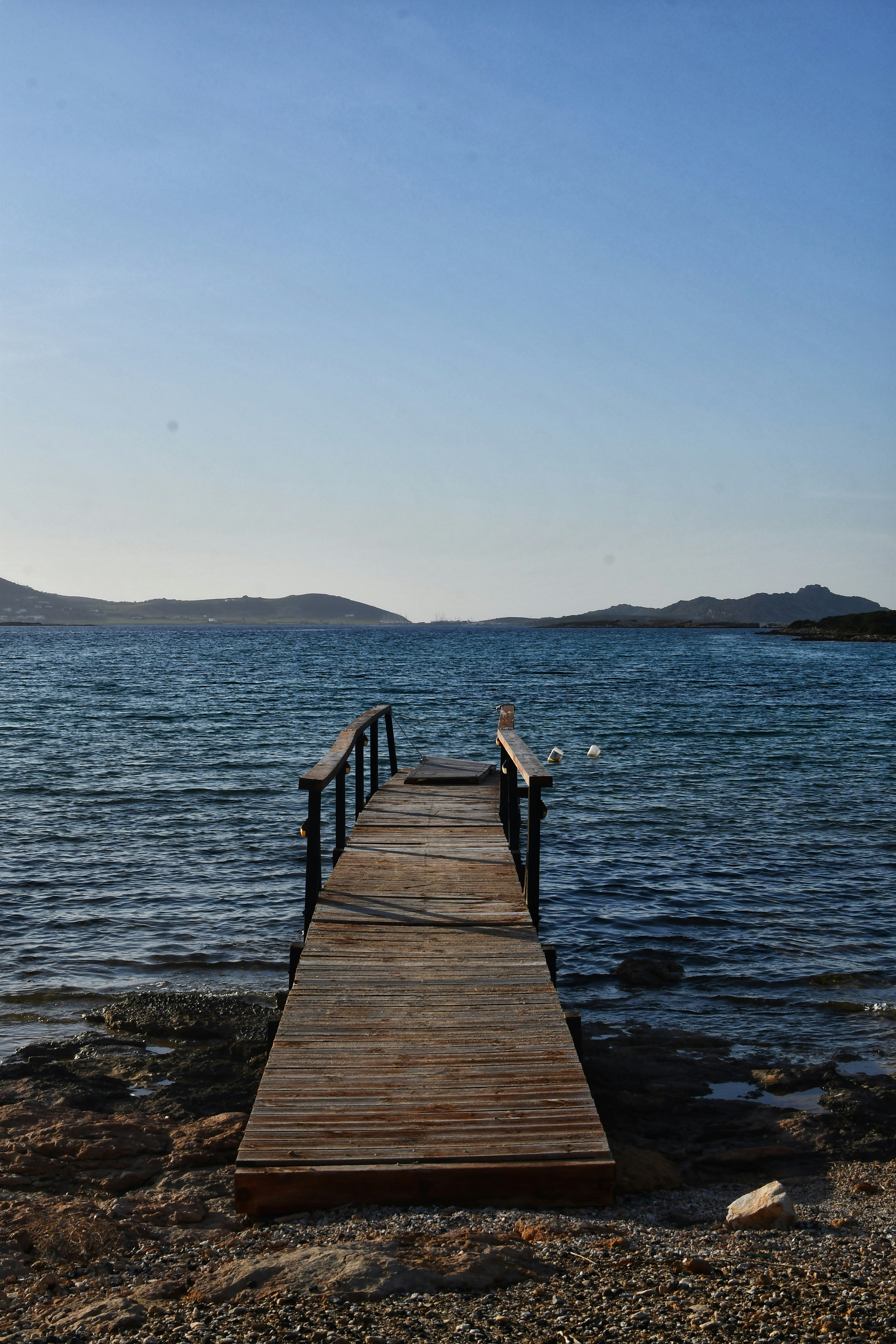 a wooden dock sitting on top of a body of water