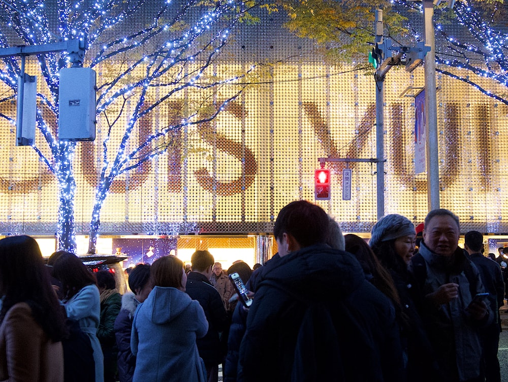 a group of people standing in front of a building