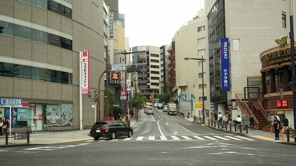 a city street filled with lots of tall buildings