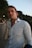 a man in a white shirt is posing for a picture