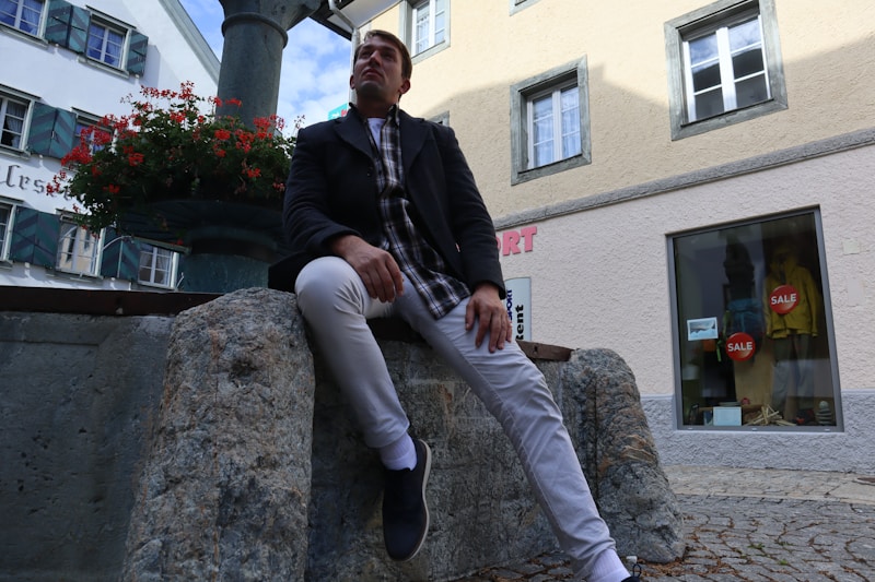 gay man on stone wall