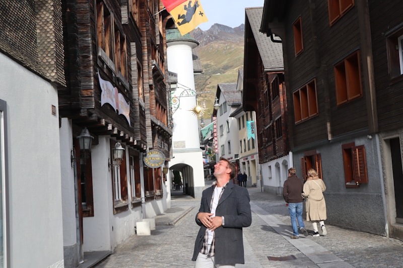 well-dressed gay man walking street