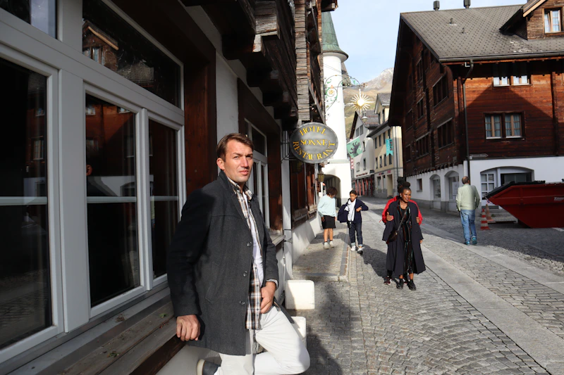 successful man walking through the city