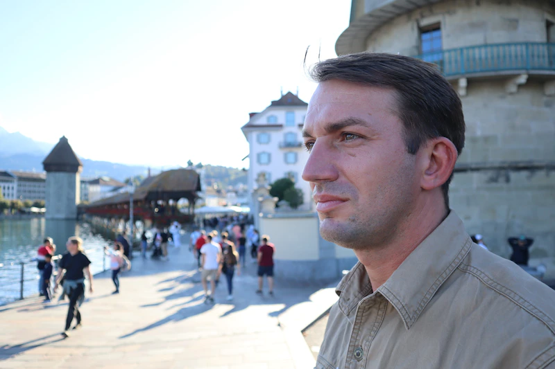 a man is standing in front of a building
