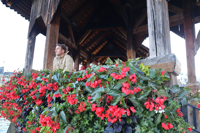 stylish man on a balcony with flowers