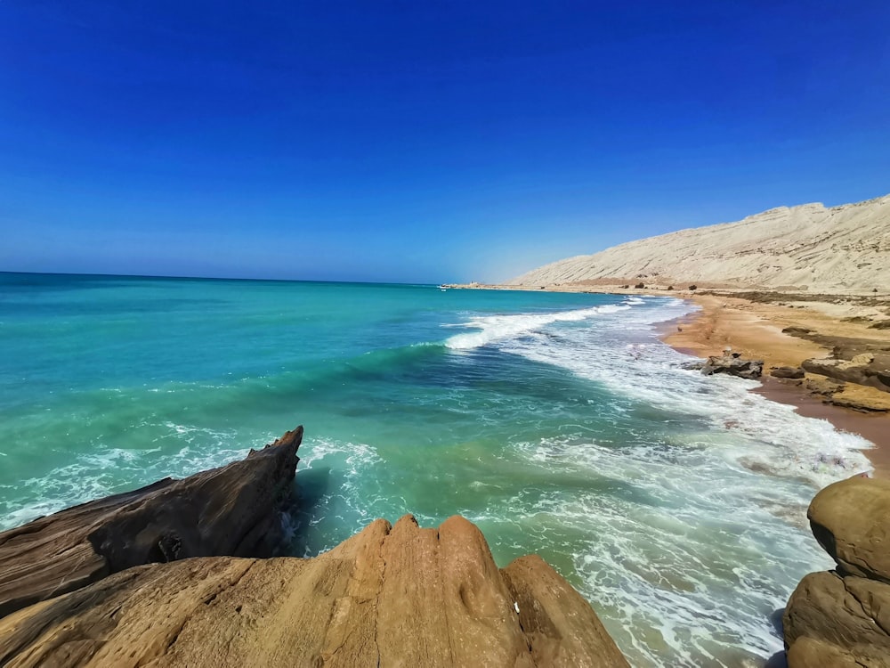 a view of the ocean from a rocky cliff