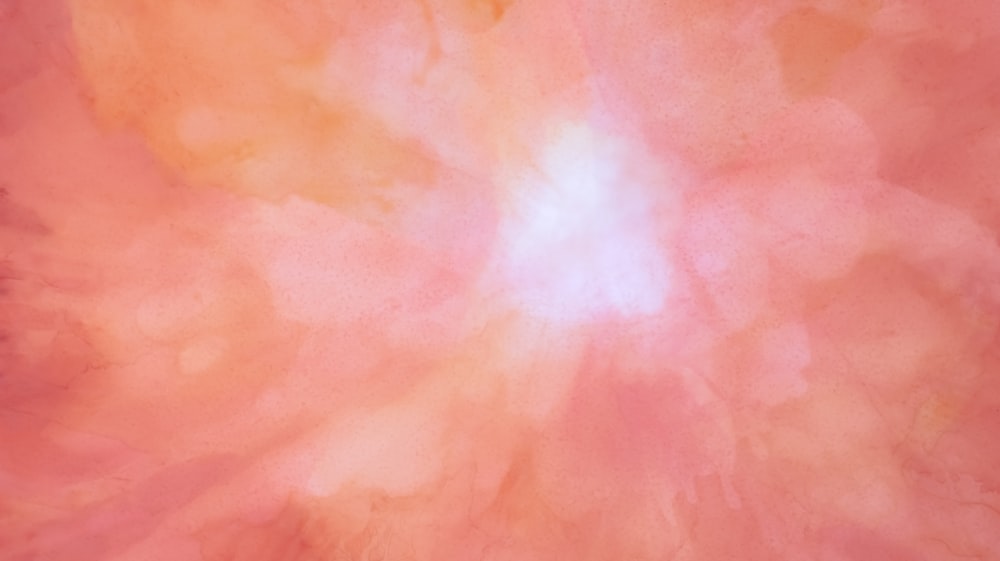 un fondo rosa y naranja con un centro blanco