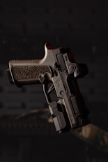 a close up of a gun in the dark