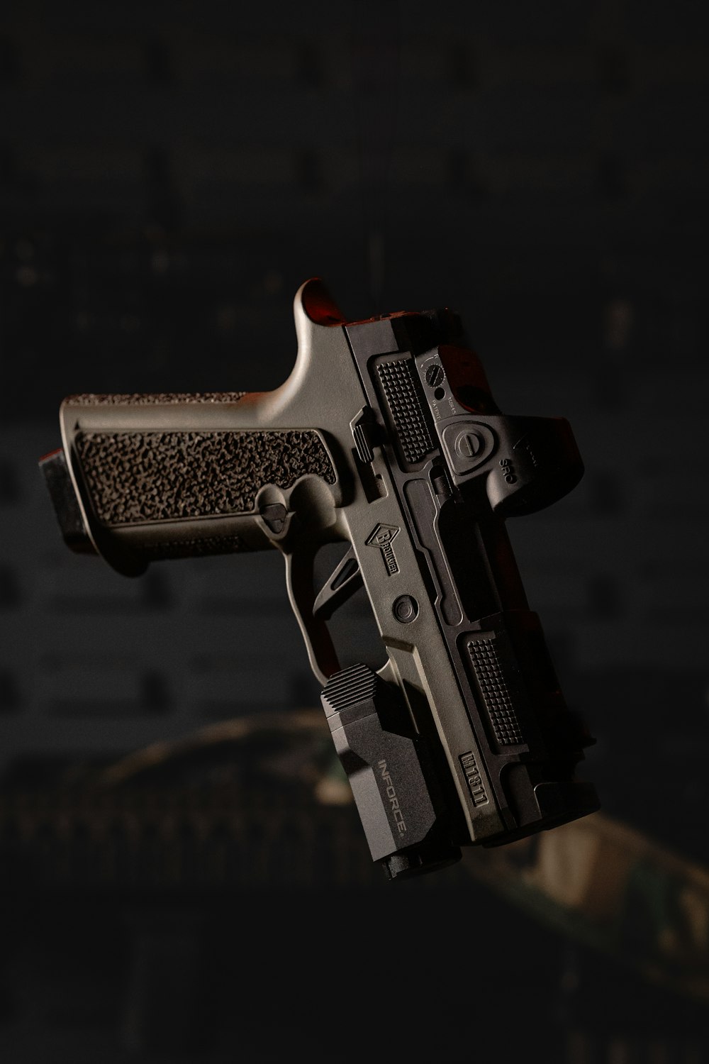 a close up of a gun in the dark