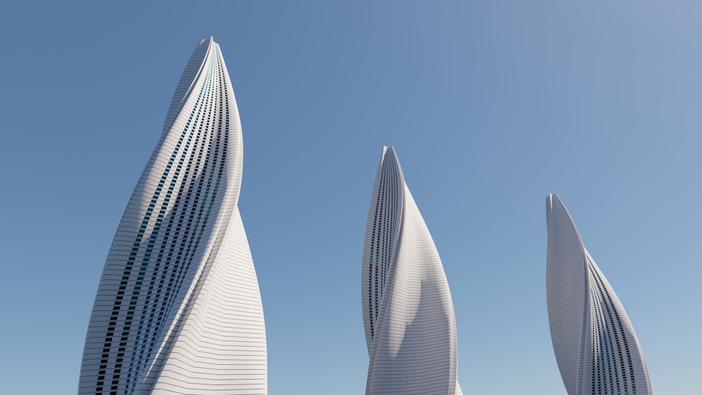 a group of tall white buildings sitting next to each other