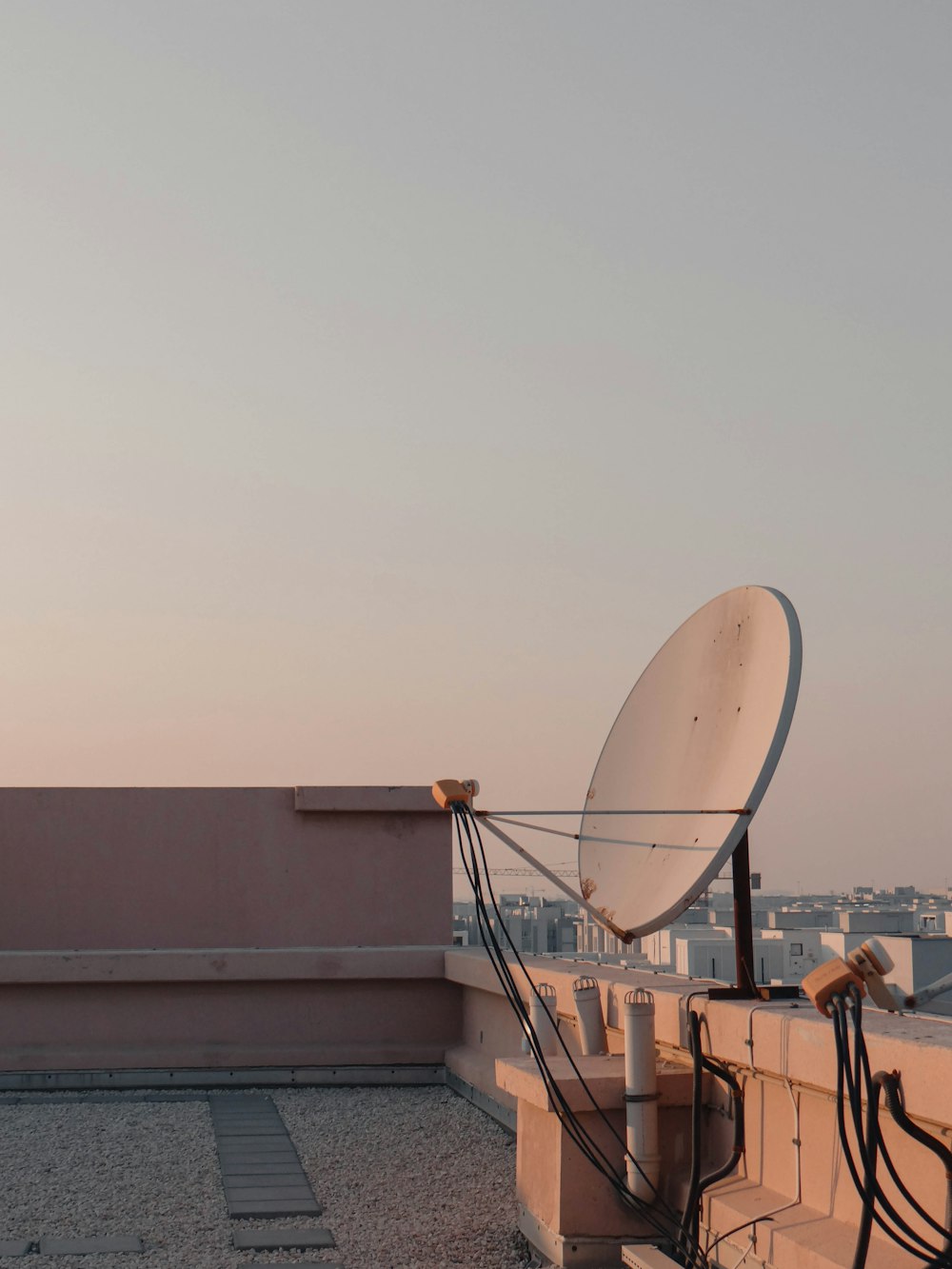 a satellite dish sitting on top of a roof