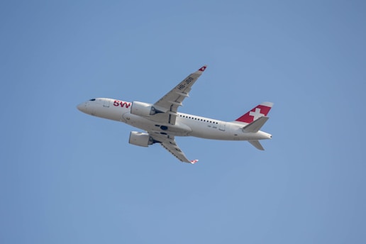 a large passenger jet flying through a blue sky