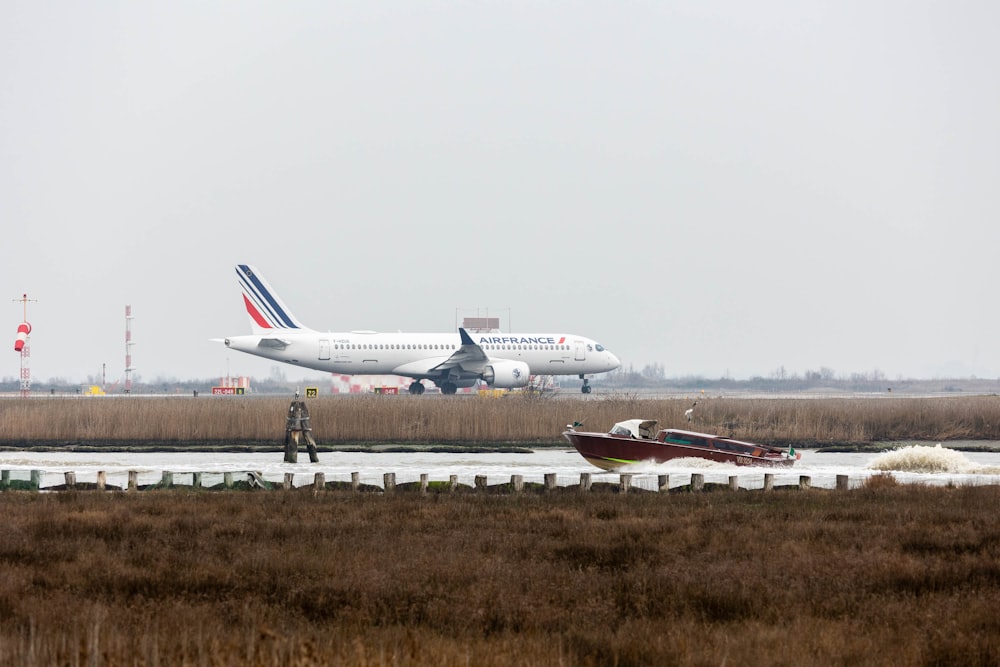 a large jetliner sitting on top of an airport runway