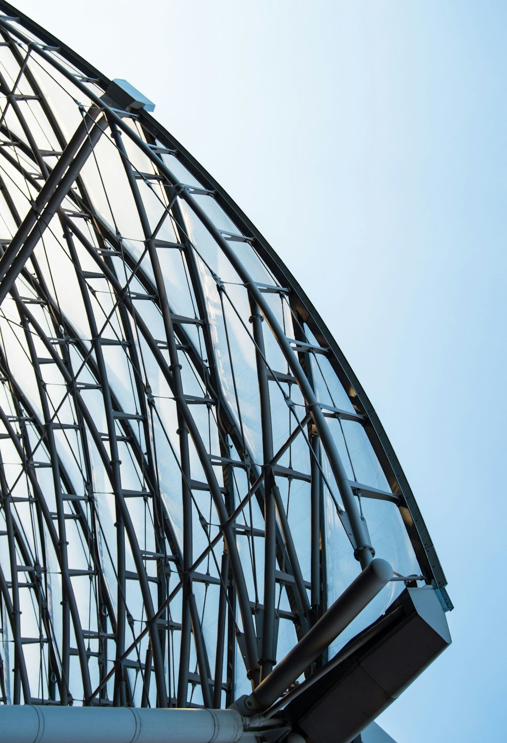 a close up of a metal structure with a sky background