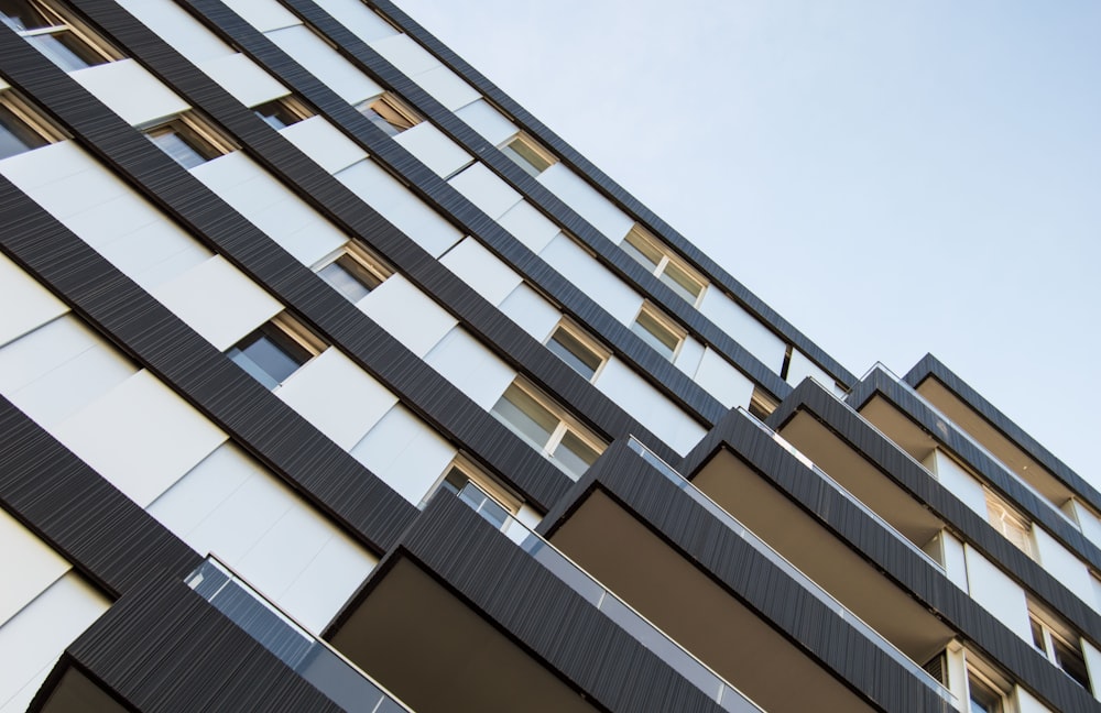 a tall building with lots of windows and balconies