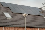 a solar panel on the roof of a house