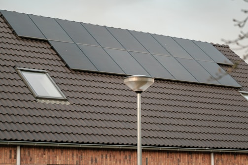 a solar panel on the roof of a house