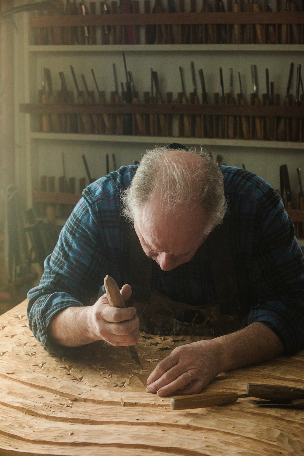 a man working on a piece of wood