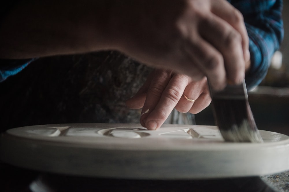 a close up of a person cutting something with a knife